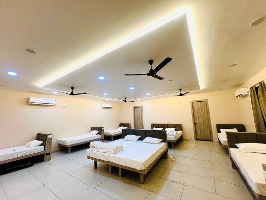 AC pilgrim dormitory at Aaravya Hotel Ayodhya — 10 and 12 bed groups